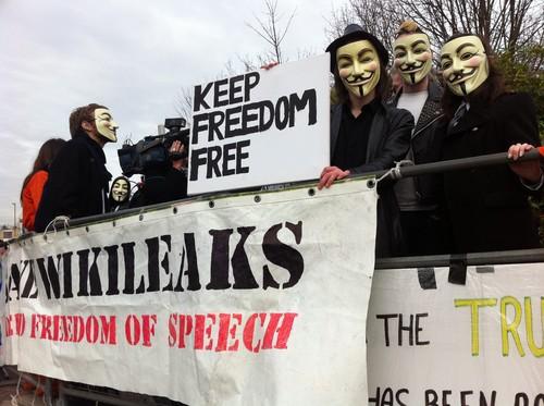 Concern is increasing that Anonymous may target critical infrastructure, and while analysts say it is possible, it is probably not likely. Pictured are supporters of Supporters for WikiLeaks founder Julian Assange outside a London court in February 2011.